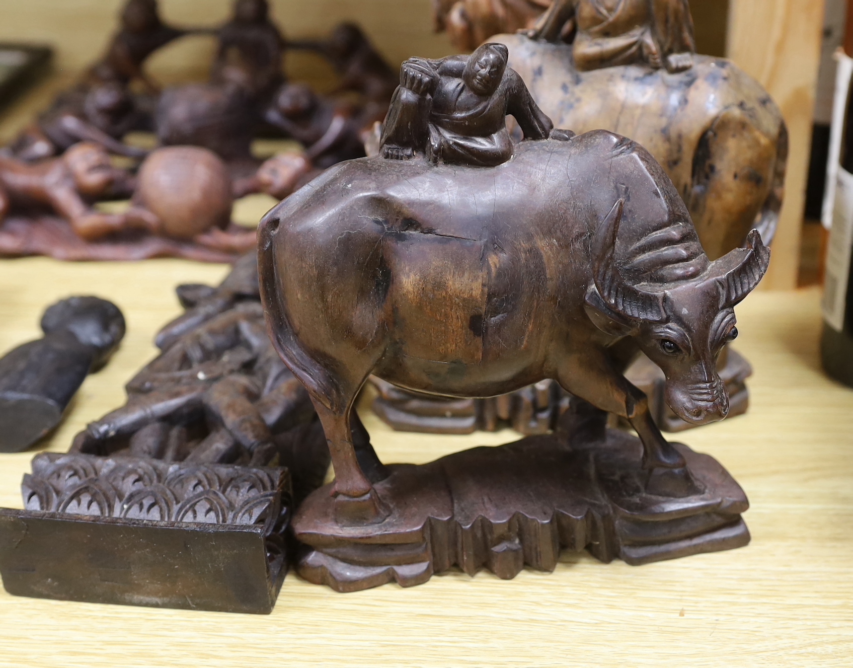 A pair of Chinese carved sage, a pair of bull and six other carvings